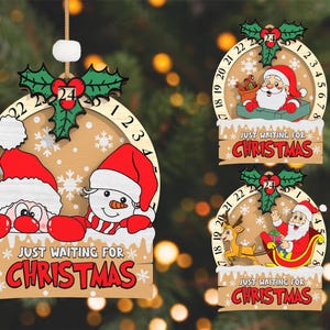 May include: Three wooden Christmas countdown ornaments with a Santa Claus, snowman, and reindeer design. Each ornament features a circular countdown with numbers 1 through 24. The ornaments have the text "Just Waiting for Christmas" on a banner below the countdown.