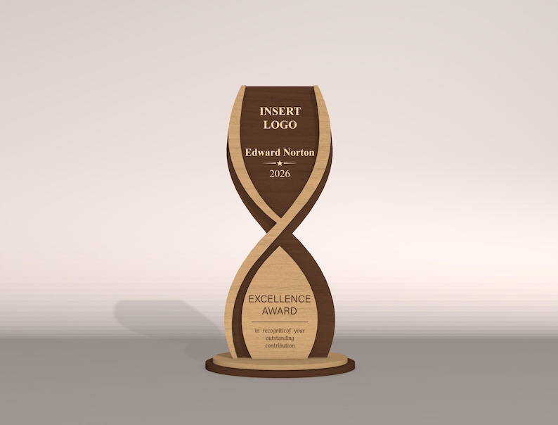 May include: A wooden Excellence Award trophy with a unique hourglass design. The trophy features a dark brown and light brown color scheme, with the text "INSERT LOGO", "Edward Norton 2026", and "EXCELLENCE AWARD" displayed on the front.