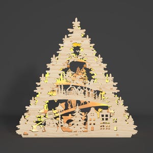 May include: A wooden Christmas tree decoration featuring a cut-out design of a winter village scene. The decoration is illuminated from behind, creating a warm glow. The scene includes houses, trees, a snowman, and a deer.