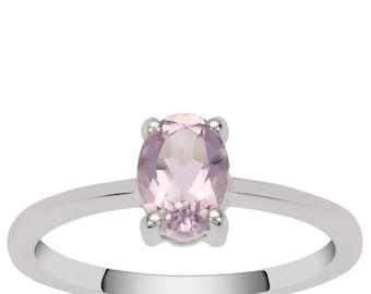 May include: A silver ring with a light pink oval gemstone.