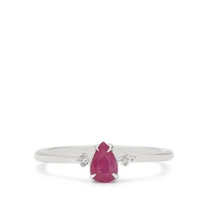 May include: A silver ring featuring a pear-shaped ruby gemstone and two smaller diamond accents.