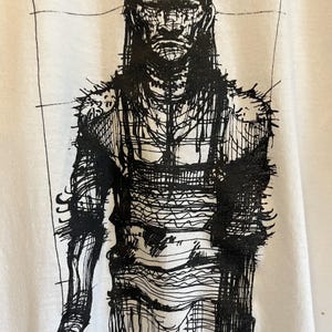 May include: Black and white illustration of a person with a barbed wire head and body. The person is wearing a long, flowing robe. The illustration is on a white background.