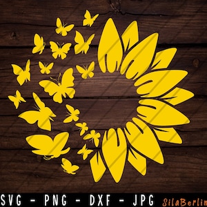 May include: A yellow sunflower with a circle of yellow butterflies around it. The sunflower is in the center of the image and the butterflies are arranged in a circle around it.