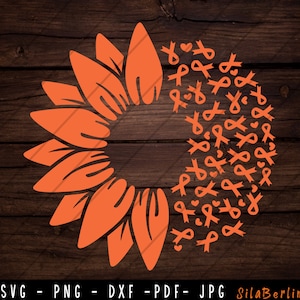 May include: Orange sunflower with a circle of orange ribbon designs around it. The ribbons are tied in a bow shape.