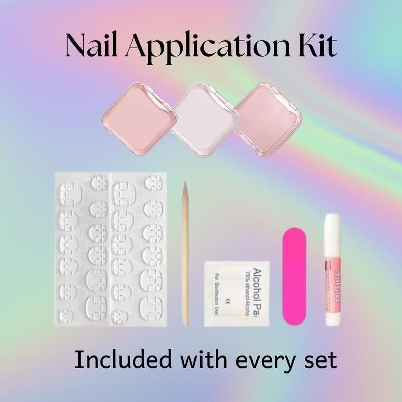 May include: A nail application kit with three pink and white containers, nail adhesive, a nail file, a cuticle stick, and alcohol wipes. The text "Nail Application Kit" and "Included with every set" are displayed.