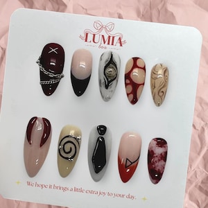 May include: A set of three ceramic mugs with a speckled, matte finish. The mugs are in shades of cream, light gray, and dark gray. Each mug has a simple, minimalist design and a rounded handle.