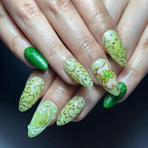 May include: A white ceramic mug with a black handle and the text "But First, Coffee" in a bold, black font. The mug is set against a blurred background, suggesting a cozy setting.