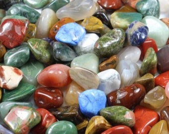 May include: A variety of tumbled crystals in various colors, including red, green, blue, brown, and yellow. The crystals are smooth and polished, and they are perfect for use in crafts, jewelry making, or for decorative purposes.