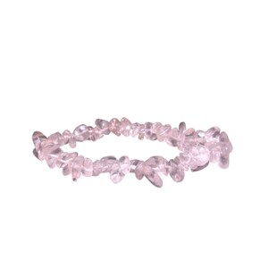 May include: A delicate bracelet made of small, clear, pink quartz chips. The bracelet is strung on elastic and is designed to fit most wrists.