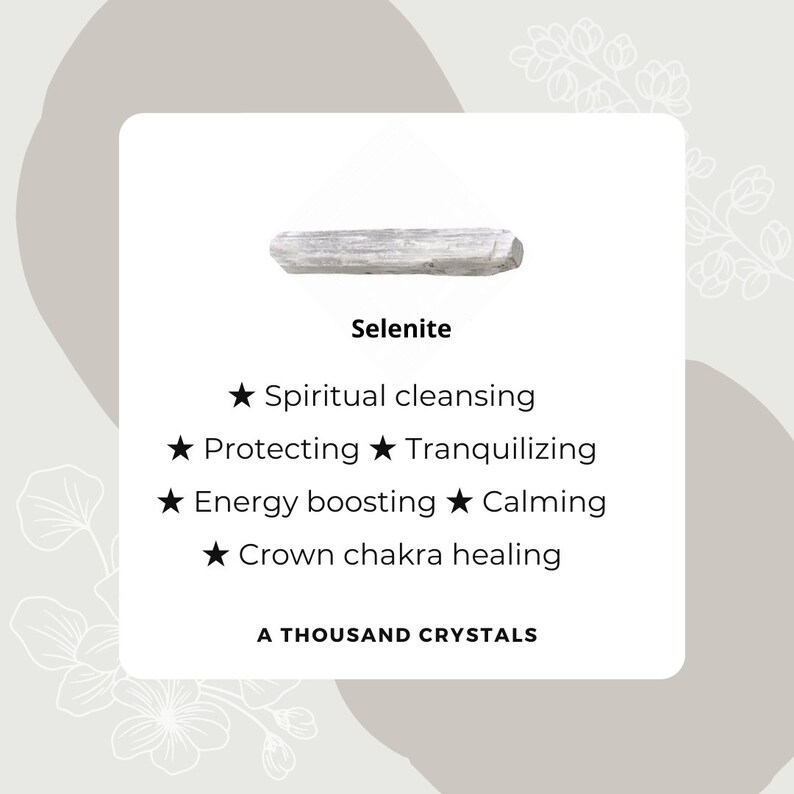 May include: A white selenite crystal, a type of mineral known for its calming and cleansing properties. The text on the image reads "Selenite", "Spiritual cleansing", "Protecting", "Tranquilizing", "Energy boosting", "Calming", "Crown chakra healing", and "A Thousand Crystals".
