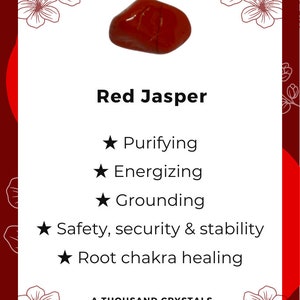 May include: Red jasper crystal with a star symbol and the text "Red Jasper" and "A Thousand Crystals". The crystal is known for its purifying, energizing, grounding, safety, security, and stability properties. It is also used for root chakra healing.