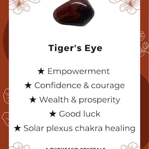 May include: A brown and gold tiger's eye crystal with a smooth, polished surface. The crystal is associated with empowerment, confidence, courage, wealth, prosperity, good luck, and solar plexus chakra healing. The text "Tiger's Eye" and "A Thousand Crystals" is also visible in the image.