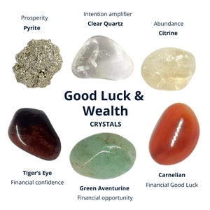 May include: A collection of six polished crystals labelled Good Luck & Wealth Crystals, including metallic pyrite, clear quartz, pale yellow citrine, dark brown tiger's eye, smooth green aventurine, and a vibrant orange carnelian stone.