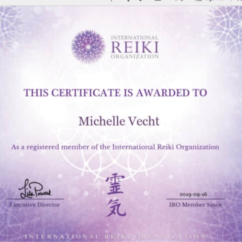 May include: A certificate from the International Reiki Organization awarded to Michelle Vecht. The certificate is dated 2019-09-16 and states that Michelle Vecht is a registered member of the organization. The certificate is signed by Lisa Power, Executive Director.