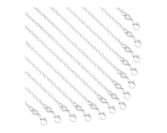 May include: A set of 12 silver chain necklaces with lobster claw clasps. The chains are arranged in a staggered pattern, with the shortest chain at the bottom and the longest chain at the top.