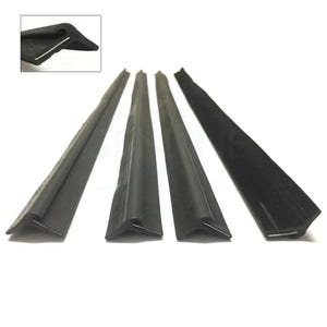 May include: Four black rubber window weather stripping seals with a triangular shape at the end. The seals are designed to prevent drafts and water from entering a window.