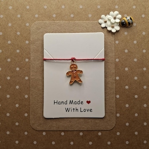 Braccialetto dei desideri con ciondolo a forma di omino di pan di zenzero / Braccialetto natalizio con cordino / Regalo "Esprimi un desiderio" / Piccolo regalo di Natale / Biglietto d'auguri Pop in a Card UK