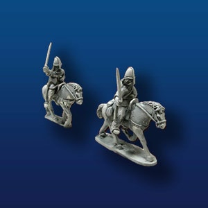 May include: Two gray painted miniature figures of medieval knights on horseback. The knights are wearing helmets and holding swords. The horses are in a running pose.