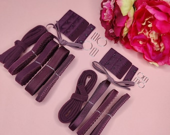 May include: A set of purple bra straps, hooks, and elastic bands for sewing or crafting projects.