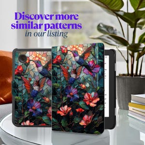 May include: A black e-reader with a cover featuring a stained-glass design of hummingbirds and flowers in shades of red, purple, and blue. The text "Discover more similar patterns in our listing" is displayed in purple.