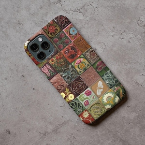 May include: A smartphone case featuring a mosaic design of various floral and geometric patterns in shades of brown, green, red, and pink. The case has a glossy finish and a camera cutout.