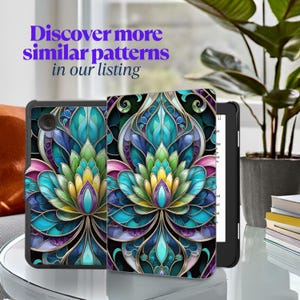 May include: A black and blue e-reader case with a colorful stained glass pattern featuring a flower design. The case is designed to fit a Kindle Paperwhite.