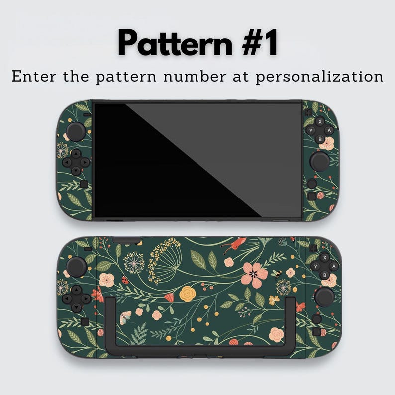May include: Two game console skins with a dark green floral pattern. The skins feature a design of flowers and leaves in shades of pink, yellow, and white. The text "Pattern #1" and "Enter the pattern number at personalization" are displayed at the top.