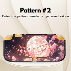 May include: A black and yellow Nintendo Switch Lite case featuring a full moon and pink cherry blossom design. The text "Pattern #2" and "Enter the pattern number at personalization" are displayed on the image.