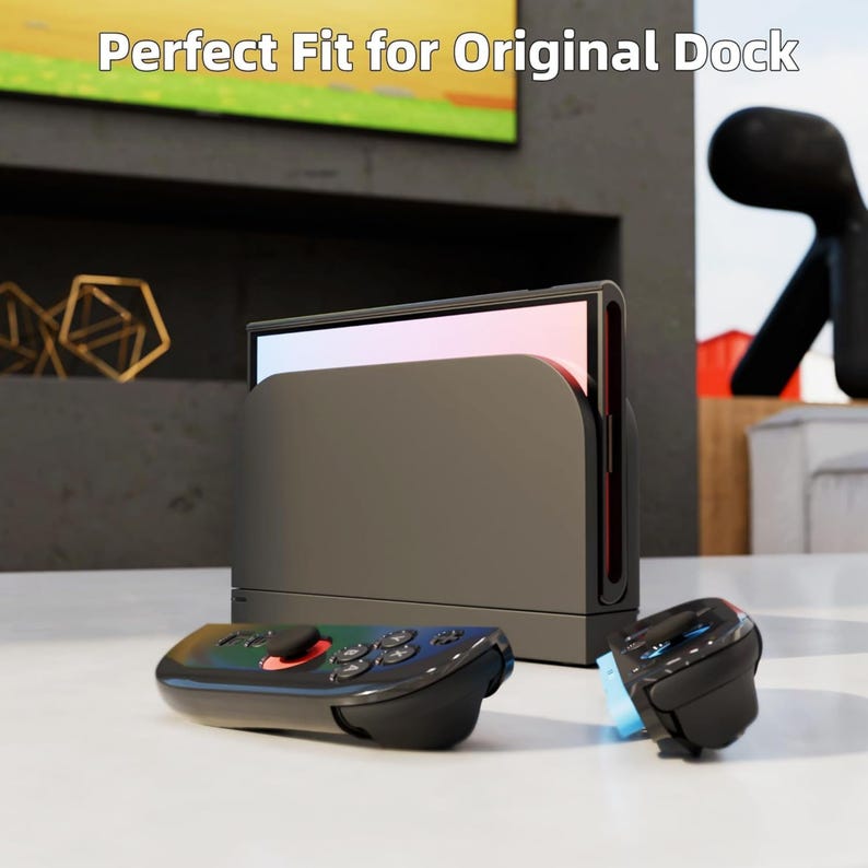 May include: A gray docking station with a black controller and a smaller black controller. The text "Perfect Fit for Original Dock" is at the top of the image. The controllers have multiple buttons and a red accent.