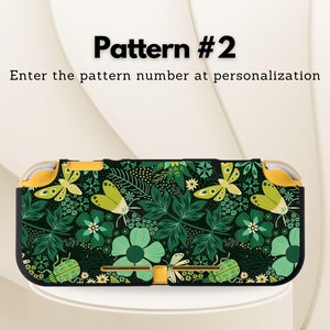 May include: A black and green patterned Nintendo Switch Lite case. The case features a floral and insect design with butterflies, flowers, and leaves. The text "Pattern #2" and "Enter the pattern number at personalization" are displayed on the image.
