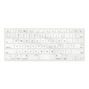 Könnte beinhalten: Eine weiße Tastatur mit schwarzen Tasten und einem Marmormuster. Die Tasten haben das Standardlayout für eine deutsche Tastatur.