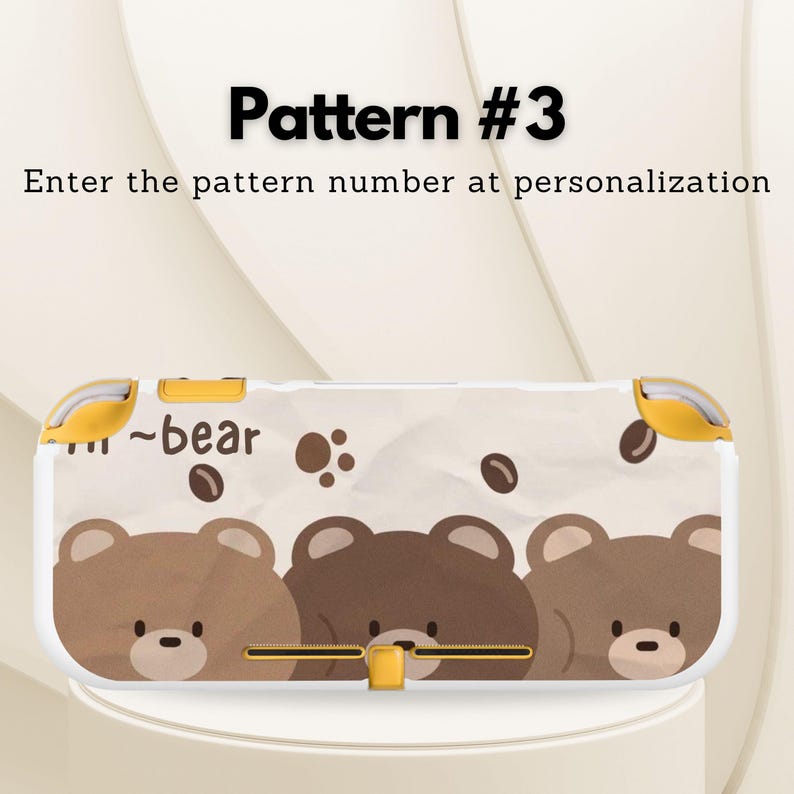 May include: A white and yellow patterned case for a handheld gaming device. The case features a repeating pattern of brown bear faces and coffee bean shapes. The text "Pattern #3" and "Enter the pattern number at personalization" are visible.