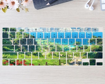 May include: A keyboard cover with a landscape design featuring green fields, blue skies, and a pathway. The keys are white with black lettering, and the function keys are blue. The cover is designed to fit a laptop keyboard.