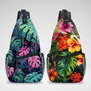 May include: Two sling backpacks with tropical floral designs. One features large green and pink monstera leaves, the other showcases vibrant orange and yellow hibiscus flowers. Both have black zippers and mesh side pockets.