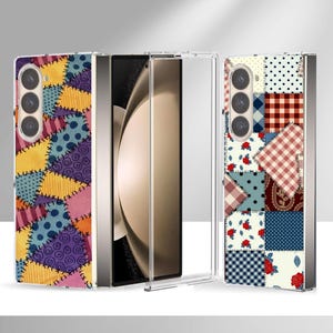 May include: A foldable smartphone case featuring a patchwork design. The left side displays yellow, purple, and blue patterned fabric squares with visible stitching. The right side shows a grid of floral, plaid, and polka dot fabric squares.