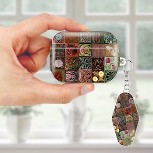 May include: A decorative AirPod case and matching keychain featuring a mosaic design with floral and geometric patterns in various colors. The case is held in a hand, showcasing the intricate details of the design.