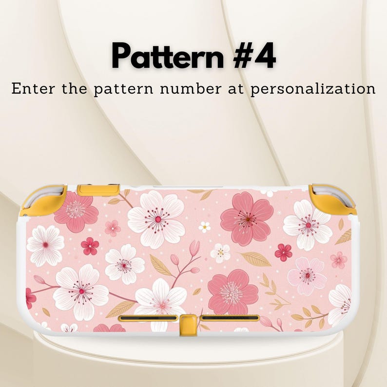 May include: A pink and white floral patterned Nintendo Switch Lite case. The case features a repeating pattern of pink and white flowers with green stems and leaves. The text "Pattern #4" and "Enter the pattern number at personalization" are visible.
