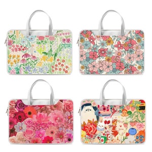 May include: Four different laptop bags with colorful floral and cartoon designs. The bags are white with a zipper closure and a handle.