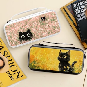 May include: Two pencil cases with cat designs. One case is white with a pink floral pattern and a black cat peeking out. The other is black with a yellow background and a black cat. Both cases have a handle and zipper.
