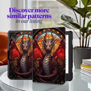 May include: A black tablet case featuring a stained-glass style dragon design with red wings and a detailed, colorful background. The text "Discover more similar patterns in our listing" is displayed in purple.