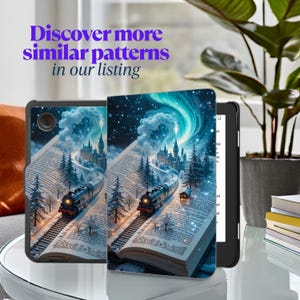 May include: A black and gray Kindle e-reader case with a colorful design of a train traveling through a book with a castle in the background. The design features a blue sky with white clouds and stars.