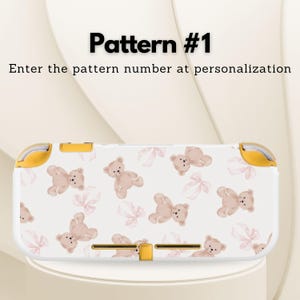 May include: White and yellow Nintendo Switch Lite case with a pattern of tan teddy bears and pink bows. The text "Pattern #1" and "Enter the pattern number at personalization" are displayed on the top of the image.