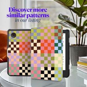 May include: A colorful checkered pattern e-reader cover with a black e-reader. The cover has a patchwork design with squares of different colors, including pink, green, blue, and brown. The e-reader is a Kindle Paperwhite.