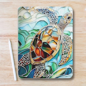 May include: A decorative tablet case featuring a stained-glass style sea turtle design. The turtle has a brown, orange, and yellow shell, with a light green and blue background. The name "Oliver" is written in cursive at the bottom.