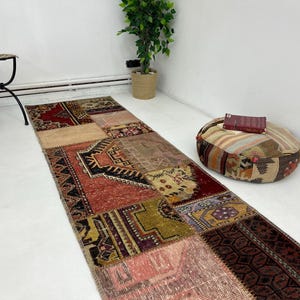 May include: A colorful patchwork runner rug with a variety of patterns and colors, including red, blue, green, and brown. The rug is made of recycled materials and is perfect for adding a touch of bohemian style to any room.