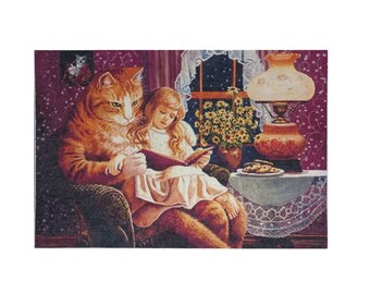 May include: A tapestry depicting a ginger cat and a young girl reading a book together in a cozy setting. The cat, with its orange fur, sits in a chair with the girl, who wears a white dress. A lamp and cookies are on a table.