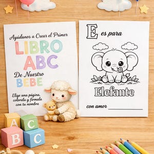 May include: Two white paper sheets with text and illustrations, a small plush lamb holding a teddy bear, four colourful alphabet blocks, and a set of coloured pencils. The left sheet reads Ayúdanos a Crear el Primer LIBRO ABC De Nuestro BEBE. The right sheet features an elephant illustration with the text E es para Elefante.