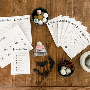May include: A Halloween-themed game with a witch's brew theme. The game includes a checklist of ingredients for the brew, such as spider webs, eyeballs, and bats. There are also cards with checkboxes and a mortar and pestle.