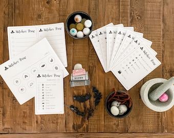 May include: A Halloween-themed game with a witch's brew theme. The game includes a checklist of ingredients for the brew, such as spider webs, eyeballs, and bats. There are also cards with checkboxes and a mortar and pestle.