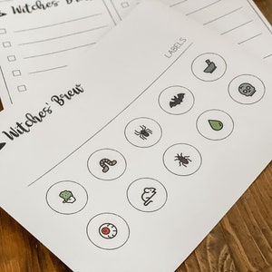 May include: A printable Halloween game with a witch's hat and the text "Witches' Brew". The game includes a list of ingredients for a witch's brew and a set of labels with images of common Halloween items, such as a spider, a bat, a skull, and a cauldron.